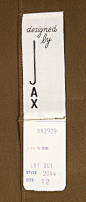 The inside label to Marilyn's brown, button up blouse.