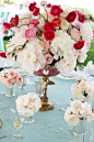 TableScapes...Table Settings / A romantic centerpiece created with pink, white & red blooms