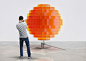 vincent leroy's sunrise installation rotates to display a globe of blurry light