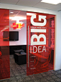 Transparent walls are cool, but a giant wall logo or giant core value with a quoted paragraph: 