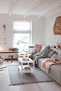 Scandinavian living room with neutral colors and pastel pink accents - Top 10 tips for adding Scandinavian style to your home