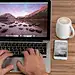 工作，办公-Man working on laptop with coffee cup and mobile phone on wooden back ...