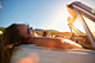 Women relaxing in convertible on beach by Gable Denims on 500px