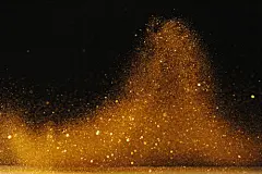 黑色背景,落下,无人,摄影,粉末_gic10340118_Falling Gold dust on black background_创意图片_Getty Images China