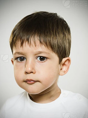 Portrait of naughty kid looking at camera.