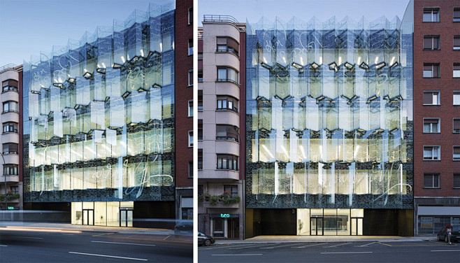 建筑面向街道的一侧的玻璃外幕墙造型为波折...