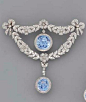 {Brooch Only} A BELLE EPOQUE SAPPHIRE AND DIAMOND BROOCH AND A PAIR OF EAR PENDANTS The central circular-cut sapphire and diamond cluster drop within the rose-cut diamond floral wreath with diamond bow terminals, suspending a sapphire and diamond drop, ea