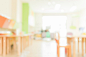 School classroom in blur background without young student; blurry view of elementary class room no kid or teacher with chairs and tables in campus. vintage effect style pictures. Free Photo