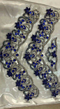 two pairs of blue and silver beaded shoelaces in plastic wrapper bag