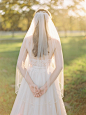 For a subtler take on sparkle, consider a veil edged with crystals, beads, or pearl accents. This bride’s fingertip-length style complements the delicate bodice of her wedding dress.
