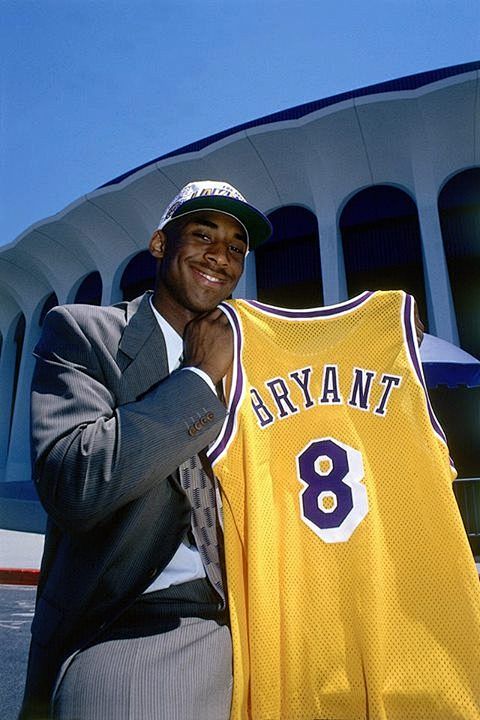 A young Kobe holding...