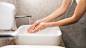 person-washing-hands-with-soap_23-2148602180