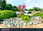 Ho Chi Minh City, Vietnam - November 19th, 2019: Bonsai garden beauty with cypress, pine, stone, water as paintings incorporate blending attract tourists sightseeing in Ho Chi Minh City, Vietnam.