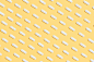 White Capsules on Yellow Background