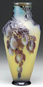 A large Galle mold blown shoulder vase with luscious plums weighing down the branch on its frosted yellow background sold for $12,937
