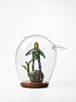 Unique Glass Pieces by Tom Moore : Australian artist Tom Moore creates beautiful award-winning glass sculptures with a unique approach.

"His animal-shaped transparent bell jars are almost a metre tall and require two skilled assistants to help with 