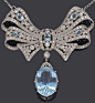 An aquamarine and diamond brooch-pendant-necklace with removable drop and chain     aquamarine weighing 21.78 carats; remaining aquamarines weighing approximately: 2.60 carats; estimated total diamond weight: 9.00 carats; mounted in eighteen karat white g