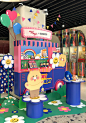 This may contain: an ice cream stand in the middle of a mall filled with balloons and decorations for children's birthdays
