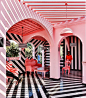 this restaurant by RENESA combines pink interiors with bold zebra stripes :  