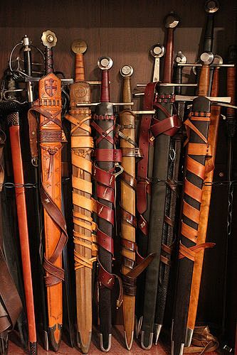 Swords in scabbards ...