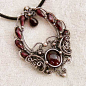 The wire work on this pendant is exquisite! I wish I had these skills. Time Traveler Silver Garnet Pendant by *Wiresculptress: 