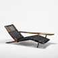 A 1951 George Nakashima Long chair made of black walnut and canvas.