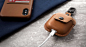 AirSnap - Carry your AirPods in a leather road case. : AirSnap is a full-grain leather case tailored to protect your AirPods while also keeping them close at hand. Slip your AirPods Charging Case into AirSnap, fasten the metal snap and your pricey ear bud