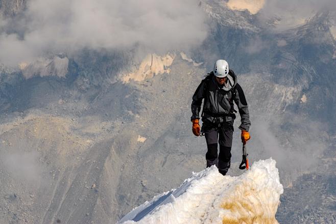 man standing on snow...