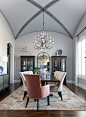 Example of a large classic dark wood floor, brown floor, vaulted ceiling and wallpaper kitchen/dining room combo design in Dallas with gray walls