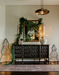Photo by Julia Arceri | Arceri Interiors on November 08, 2024. 可能是包含下列内容的图片：烛台、灯光、边柜、金葱彩带、灯笼、大橱柜和室内.