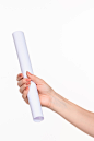 white-cylinder-props-female-hands-white-background-with-right-shadow_155003-17700