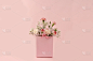 粉红色盒子里的康乃馨，抽象的春季花卉背景。创意现代花束，简约的节日概念。妇女节或母亲节贺卡，生日快乐