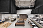 Lebel & Bouliane and Mazen Studio Design Bensimon Byrne's Toronto Office : Chairs by GamFratesi gather on the all-hands area’s oak platform. Photography by Adrien Williams.