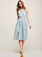 Free People St Bleu Swoon Dress : St Bleu Swoon Dress | Vintage-inspired denim dress featuring buttonup placket and double-breasted pockets. Crossover back and elastic waistband for an easy, effortless fit. Paint splatter detail along the skirt and contra