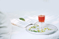 drink on a plate with a book behind it