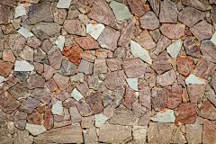 红色、姜黄色、米黄色和棕色的石材纹理墙、砖、模板、背景与复制空间