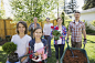 Portrait of smiling multi-generation family gardening by Hero Images on 500px