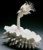 Hybrid Mergence No. 2  by Lindsy Feuer  Lindsay Feuer is a ceramic artist born and raised outside of Philadelphia. She creates unique and whimsical porcelain sculptures inspired by organic forms in nature.