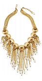 Gold-plated snail chains with dangling crystal beads emerge from concave circles on this 1950's Napier Necklace design.