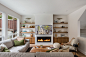 Transitional light wood floor and beige floor living room photo in Vancouver with beige walls and a ribbon fireplace