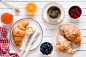 Croissants, coffee, jam and fruits. Continental breakfast table top view by Vladislav Nosick on 500px