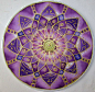 This Mandala represents the Crown Chakra. It is the connection we have with our higher source. It is painted in colors of indigo, purple, and: 