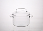 huy pham has created a set of transparent cooking pots made from technical glass : huy pham's project consists of three different-sized pots made from durable heat-resistant borosilicate glass, generally used in laboratory glassware.