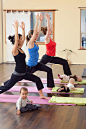 Mothers and babies taking yoga class