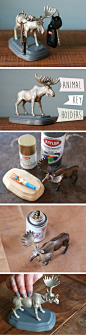 Use a plastic animal toy, wooden plaque and a touch of your favorite spray paint to make this freestanding “handy helper” to hold keys, sunglasses and other entryway odds and ends.: 
