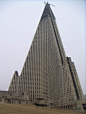 Ryugyong Hotel, N. Korea. Construction began in 1987 and halted in 1992 due to outrageous building costs. Abandoned for many years, an Egyptian company is attempted to complete the work, but whether or not the building is even stable after so many years o