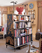 A DOUBLE-SIDED BOOKCASE as a room divider.  Separates the living and dining areas of decorator Alex Papachristidis’s apartment in Manhattan ...