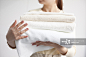 Woman holding folded towel