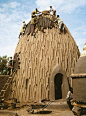 Musgum mud huts are traditional Cameroon homes built of mud. Musgum huts were built in a variety of shapes: some tall domes, others conical, others a reverse-V shape, and still others geometric designs. Local residents built them from mud, thatch, and wat