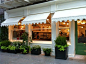 Beautiful! #shop #restaurant #window#white #awning #molding #container #garden